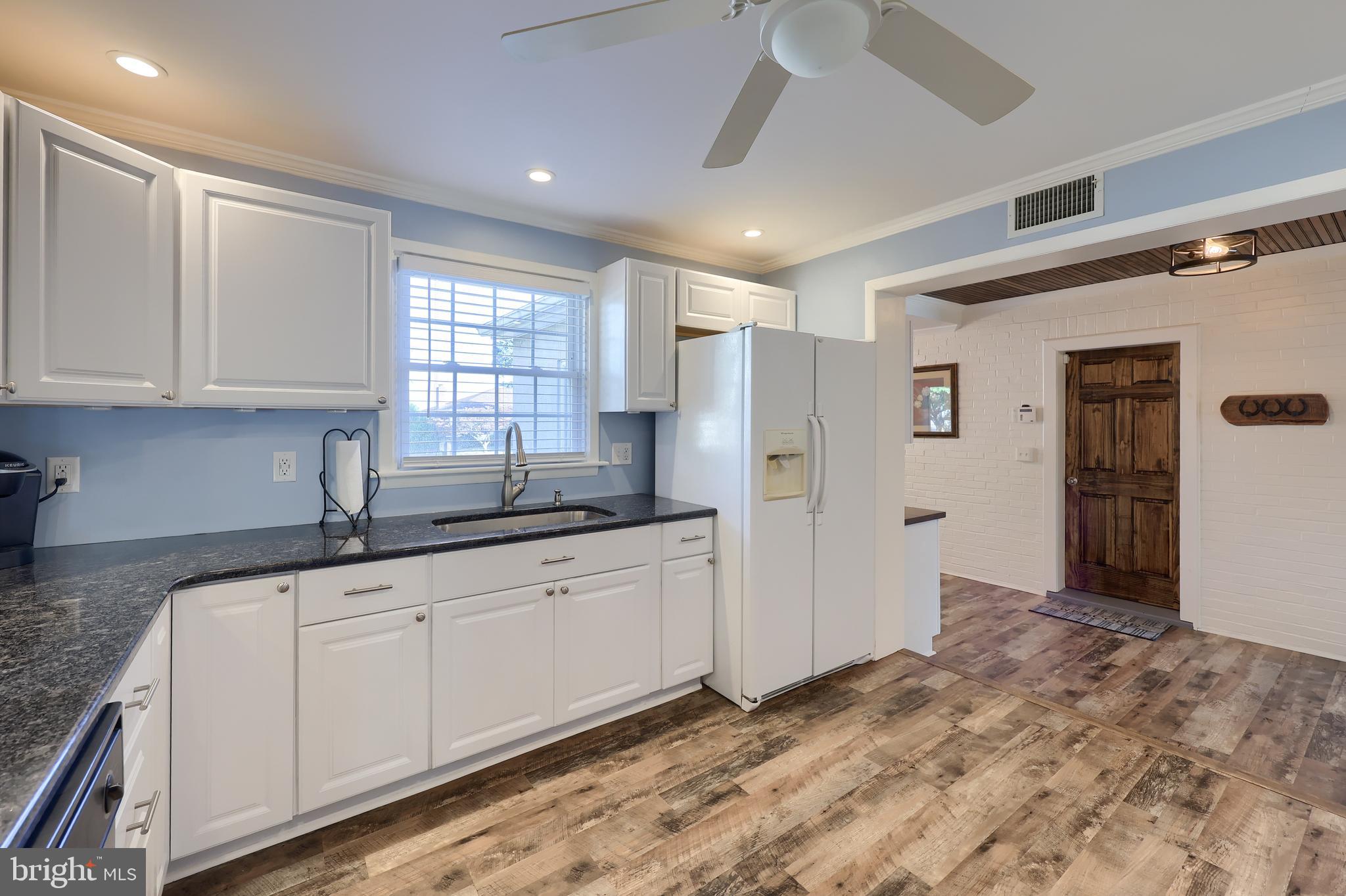 304 Edgehill Road York, PA 17403 - Photo 13 of 44 a kitchen with granite countertop a sink stainless steel appliances and cabinets