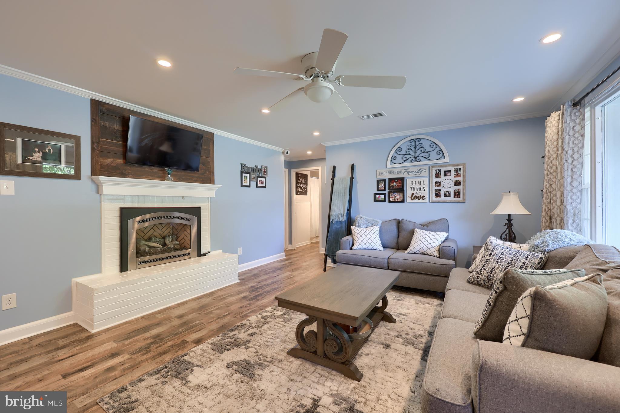 304 Edgehill Road York, PA 17403 - Photo 6 of 44 a living room with furniture a flat screen tv and a fireplace