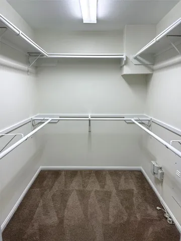 a view of an empty walk in closet