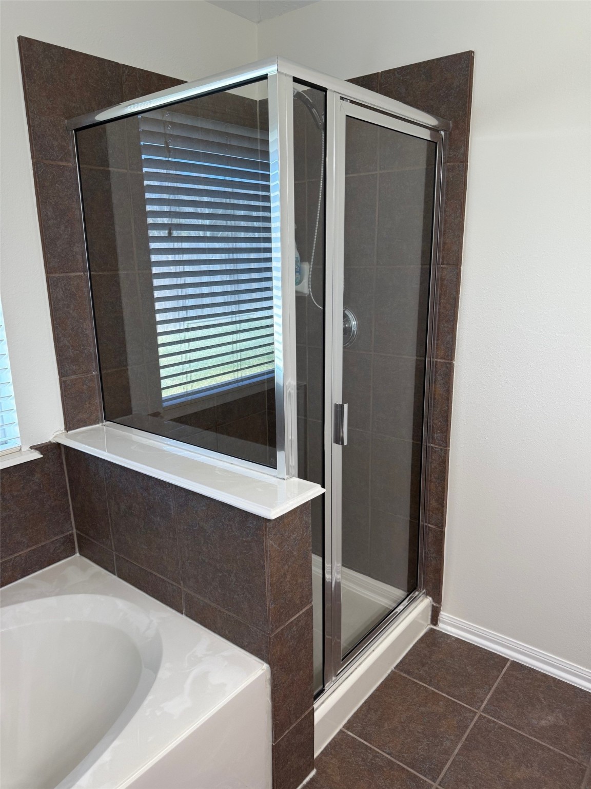 16818 Ranger Ridge Drive Cypress, TX 77429 - Photo 20 of 31 a bathroom with a bathtub and a shower