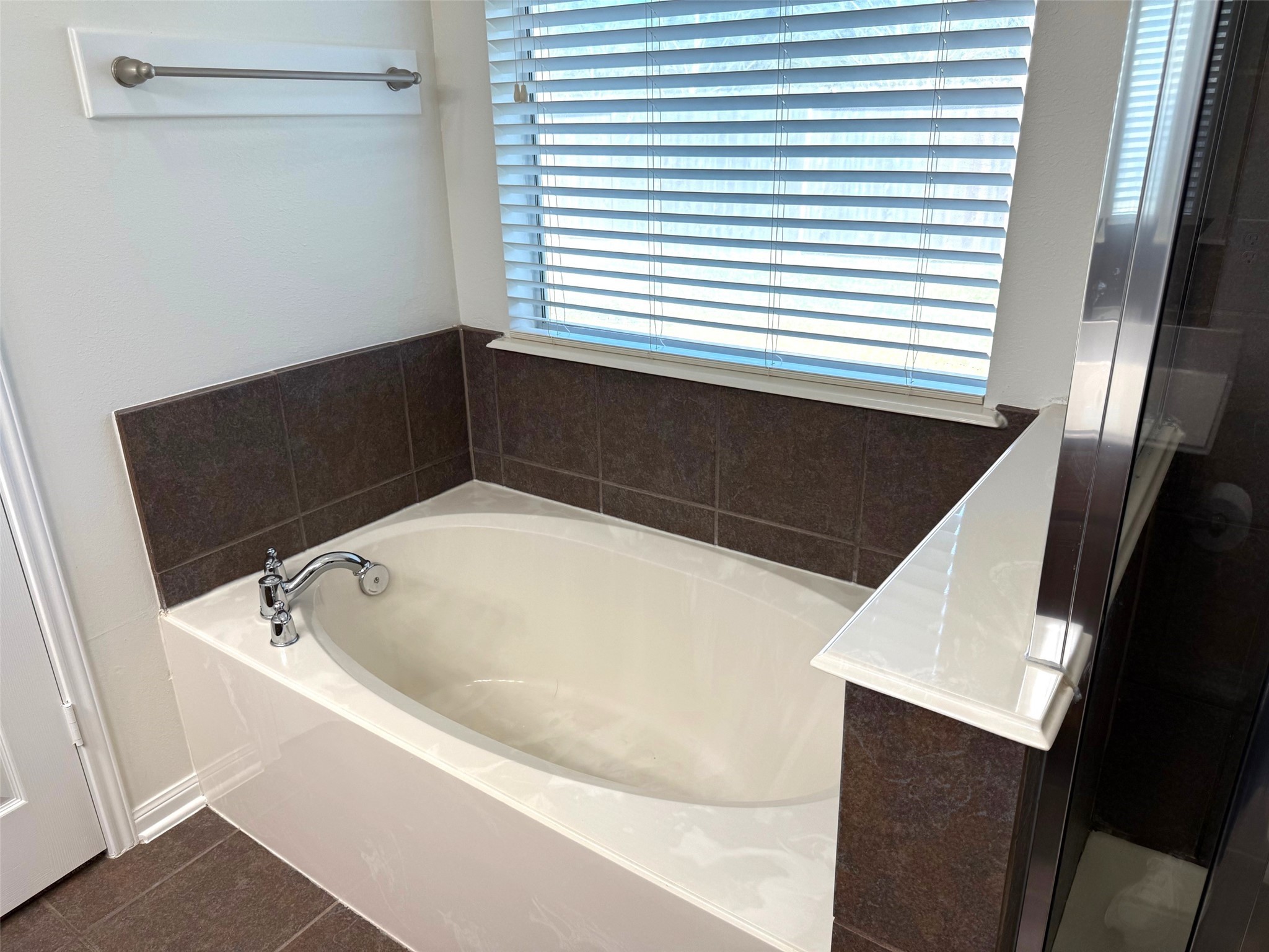 16818 Ranger Ridge Drive Cypress, TX 77429 - Photo 21 of 31 a bathroom with a bathtub and a sink