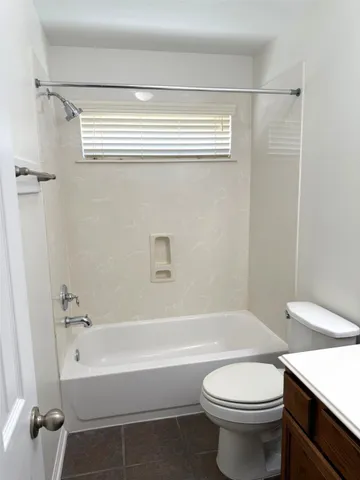 a bathroom with a sink a toilet and a bathtub
