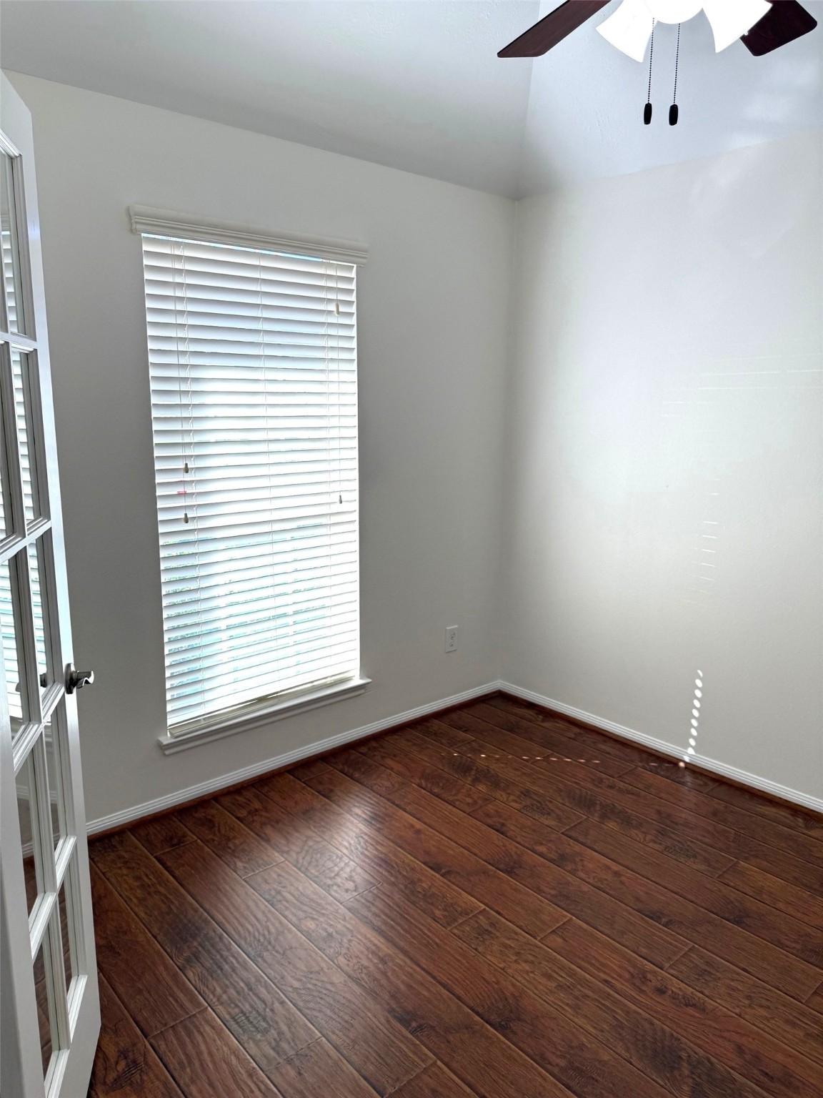 16818 Ranger Ridge Drive Cypress, TX 77429 - Photo 10 of 31 an empty room with wooden floor and windows