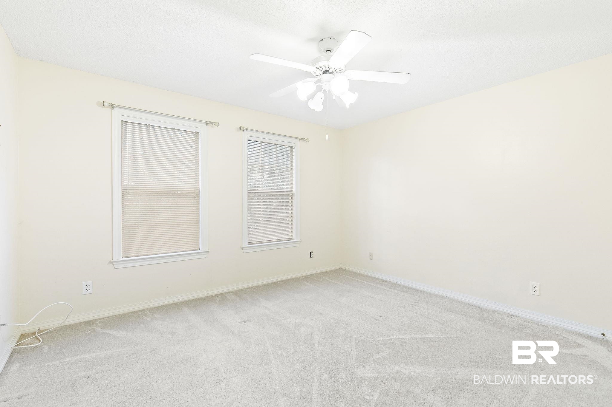2100 Stonebrook Drive West Mobile, AL 36695 - Photo 37 of 60 Unfurnished room with ceiling fan and light colored carpet