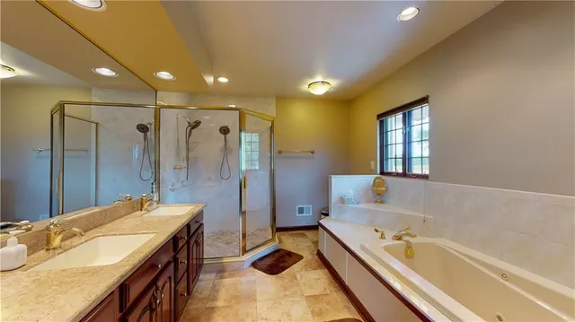 a bathroom with a double vanity sink and a mirror