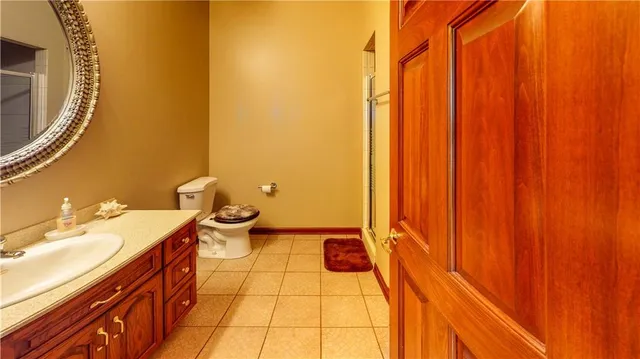 a utility room with a sink a cabinetry and a washer dryer
