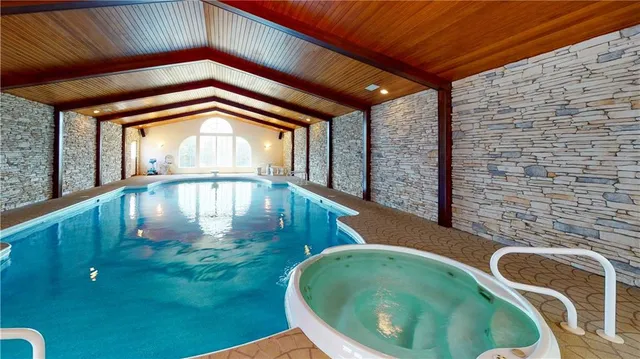 a view of swimming pool with outdoor seating