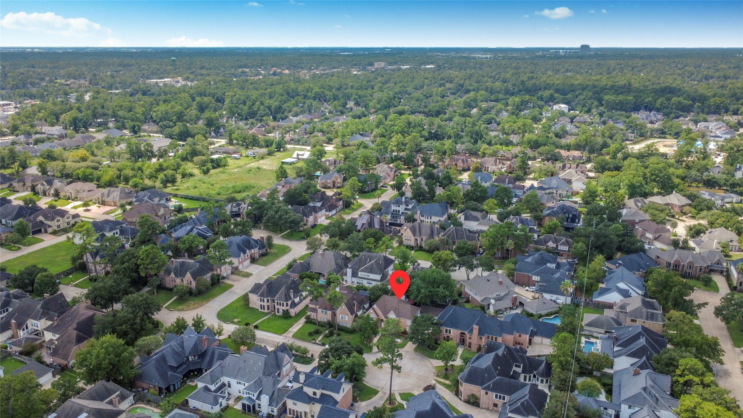 17311 Rothko Lane Spring, TX 77379 - Photo 4 of 37 Charming suburban neighborhood with spacious homes, lush greenery, and a serene atmosphere, perfect for families seeking tranquility and community.