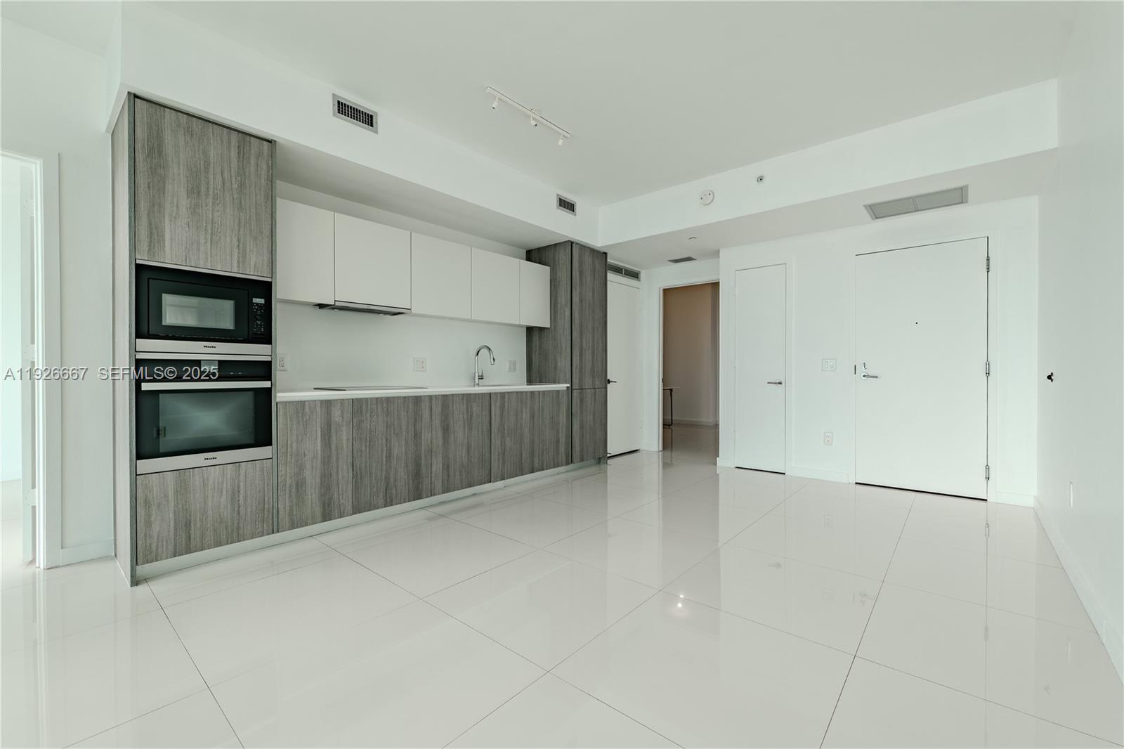 2900 Northeast 7th Avenue, Unit 2006 Miami, FL 33137 - Photo 4 of 16 a view of kitchen with refrigerator and cabinets