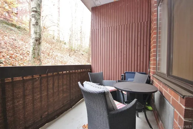 a view of a dining room with furniture and window