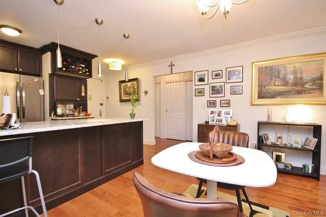 a kitchen with a table and chairs in it