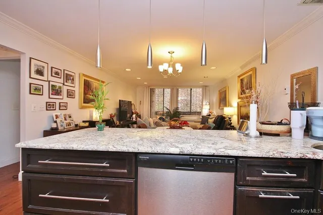 a view of a kitchen counter top space and cabinets