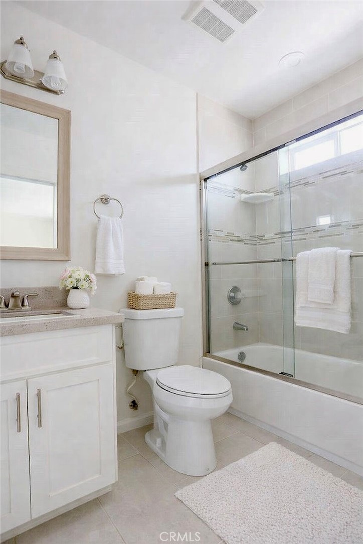 12500 Wilmington Avenue, Unit A Compton, CA 90222 - Photo 4 of 8 a bathroom with a sink toilet vanity and shower