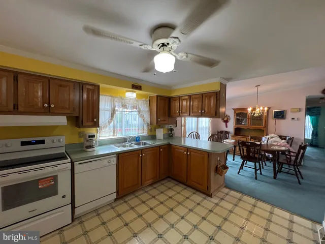 a kitchen with lots of counter top space and appliances