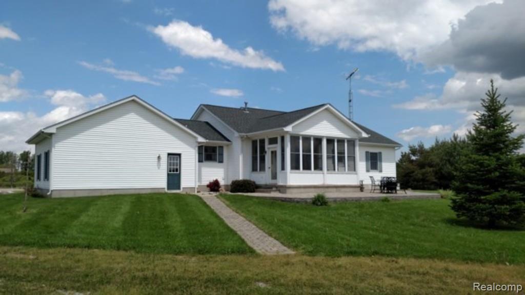11633 Wilkes Road Yale, MI 48097 - Photo 24 of 30 This is another view of the back of the home that also shows the garage.