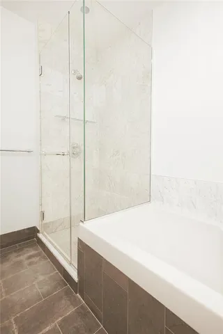 a spacious bathroom with a granite countertop sink and a mirror