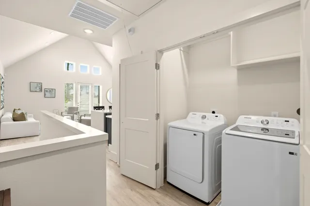 a spacious bedroom with a bed and a couch