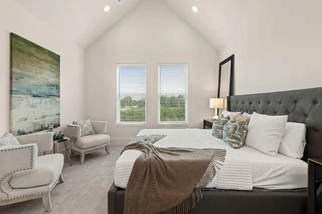 a bedroom with a bed and a night stand