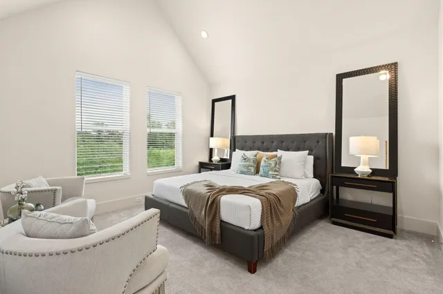 a bedroom with a bed and a couch