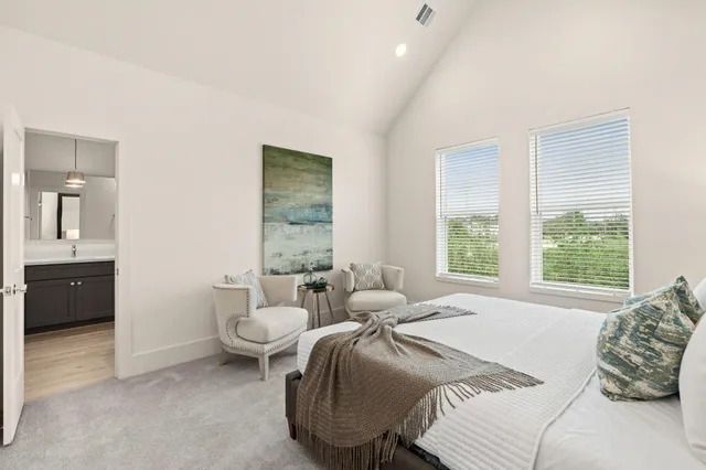 a bathroom with double sink and a mirror