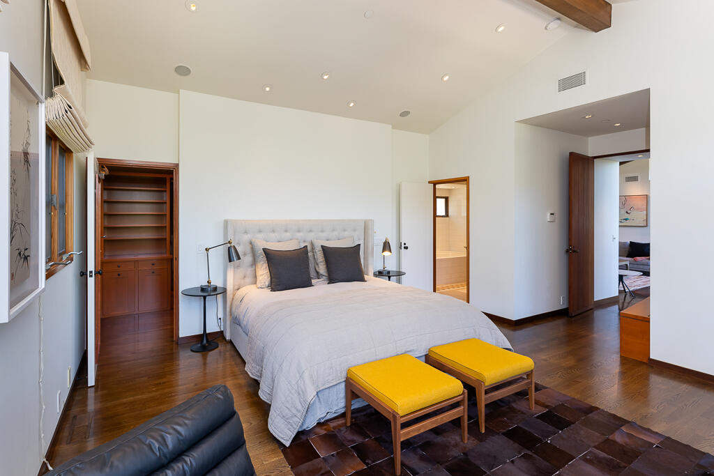 622 Cowles Road Montecito, CA 93108 - Photo 15 of 33 a bedroom with a bed and wooden floor