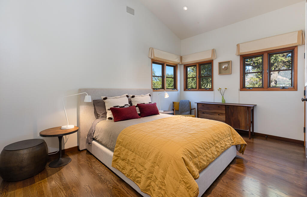 622 Cowles Road Montecito, CA 93108 - Photo 18 of 33 a bedroom with a bed and wooden floor