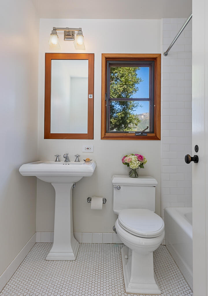 622 Cowles Road Montecito, CA 93108 - Photo 19 of 33 a bathroom with a toilet a sink and mirror