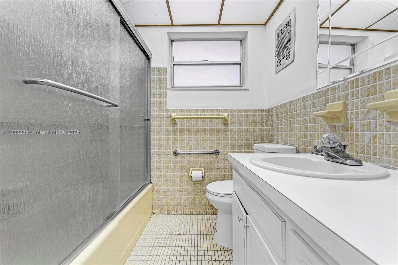 330 Southeast 2nd Street, Unit 103G Hallandale Beach, FL 33009 - Photo 13 of 37 a bathroom with a sink a toilet and shower