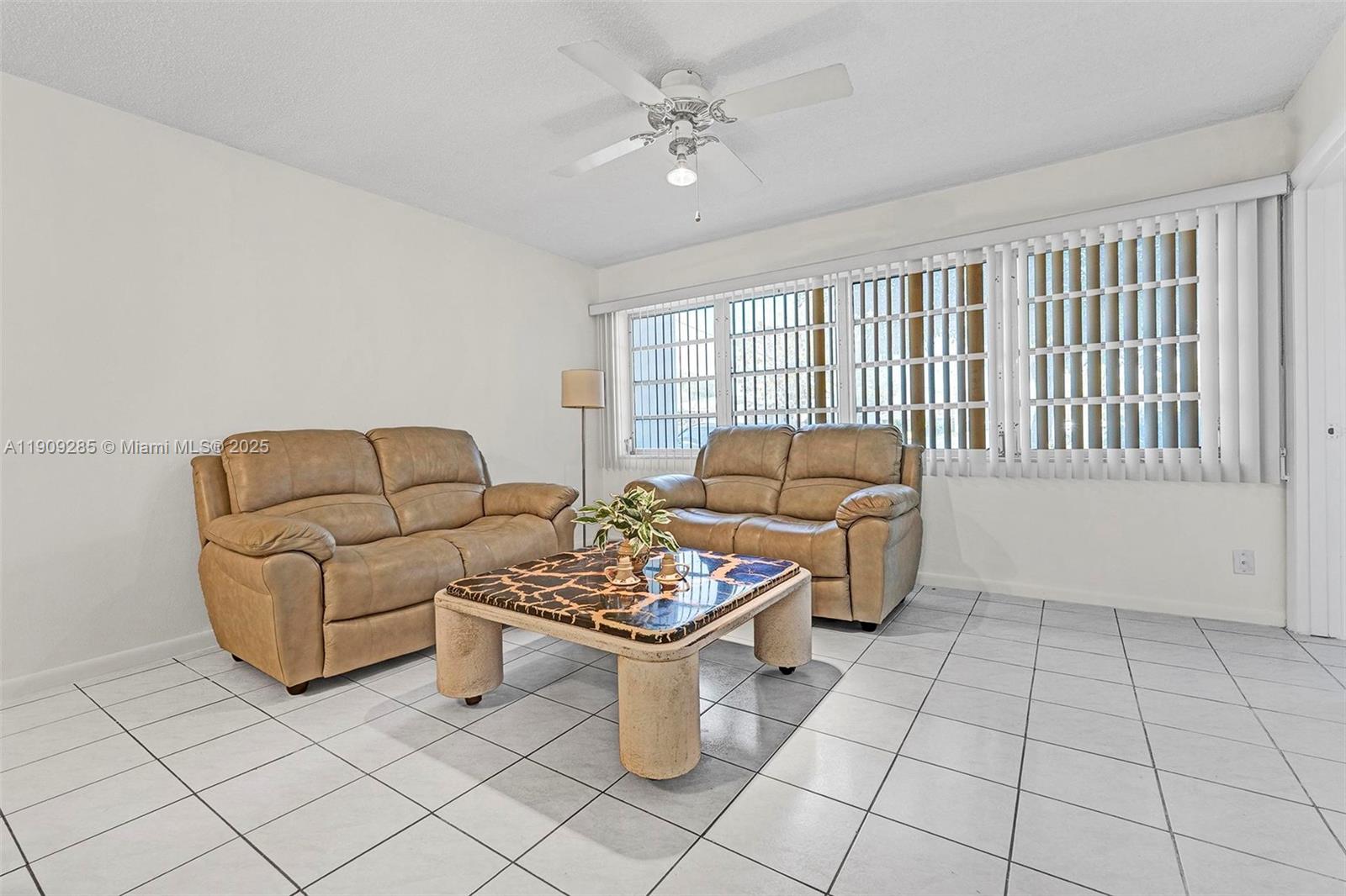 330 Southeast 2nd Street, Unit 103G Hallandale Beach, FL 33009 - Photo 17 of 37 a living room with furniture and a window
