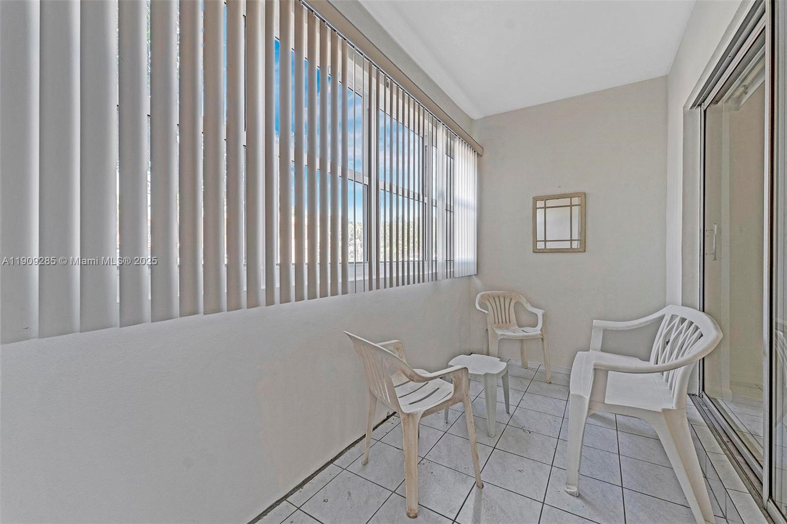 330 Southeast 2nd Street, Unit 103G Hallandale Beach, FL 33009 - Photo 24 of 37 a view of two chairs in a room