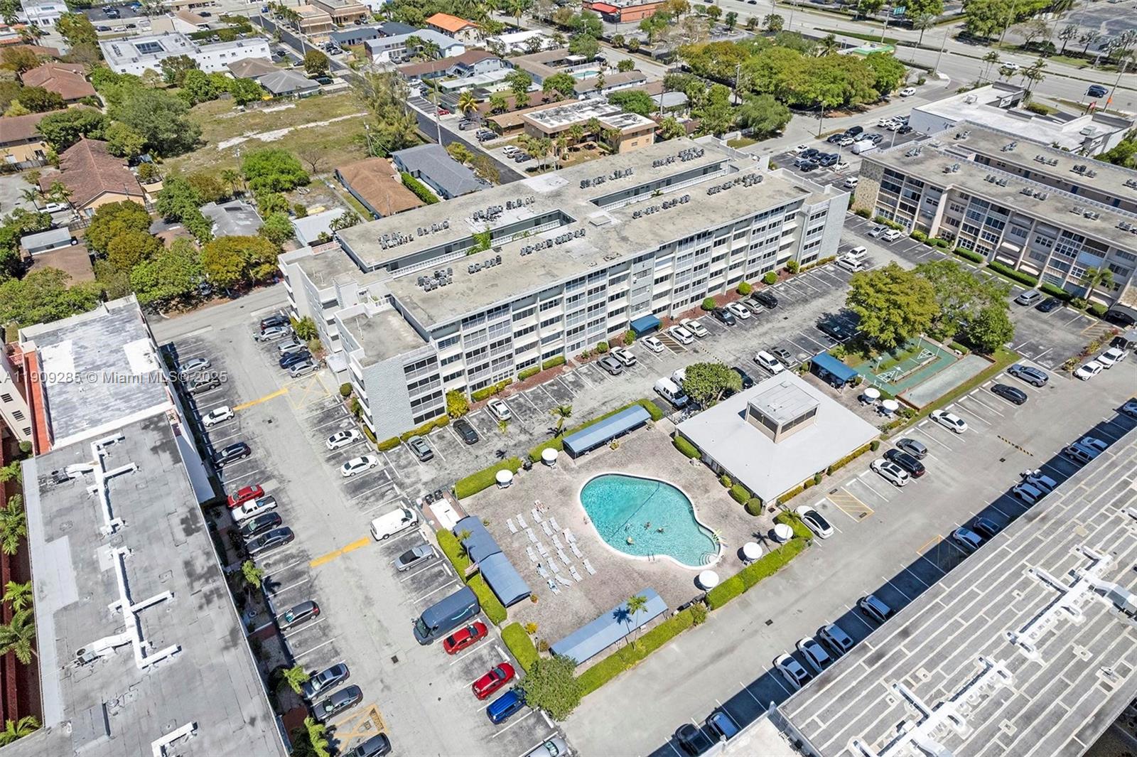 330 Southeast 2nd Street, Unit 103G Hallandale Beach, FL 33009 - Photo 33 of 37 an aerial view of a house with a garden