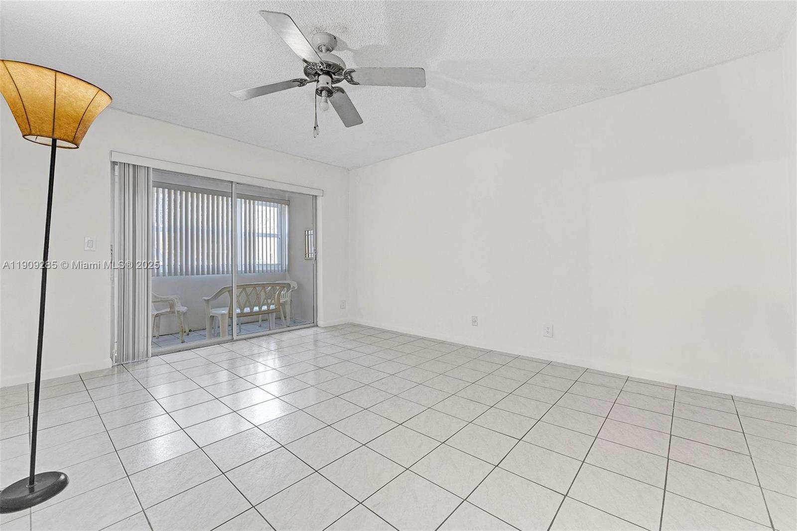 330 Southeast 2nd Street, Unit 103G Hallandale Beach, FL 33009 - Photo 9 of 37 a view of an empty room and a chandelier fan