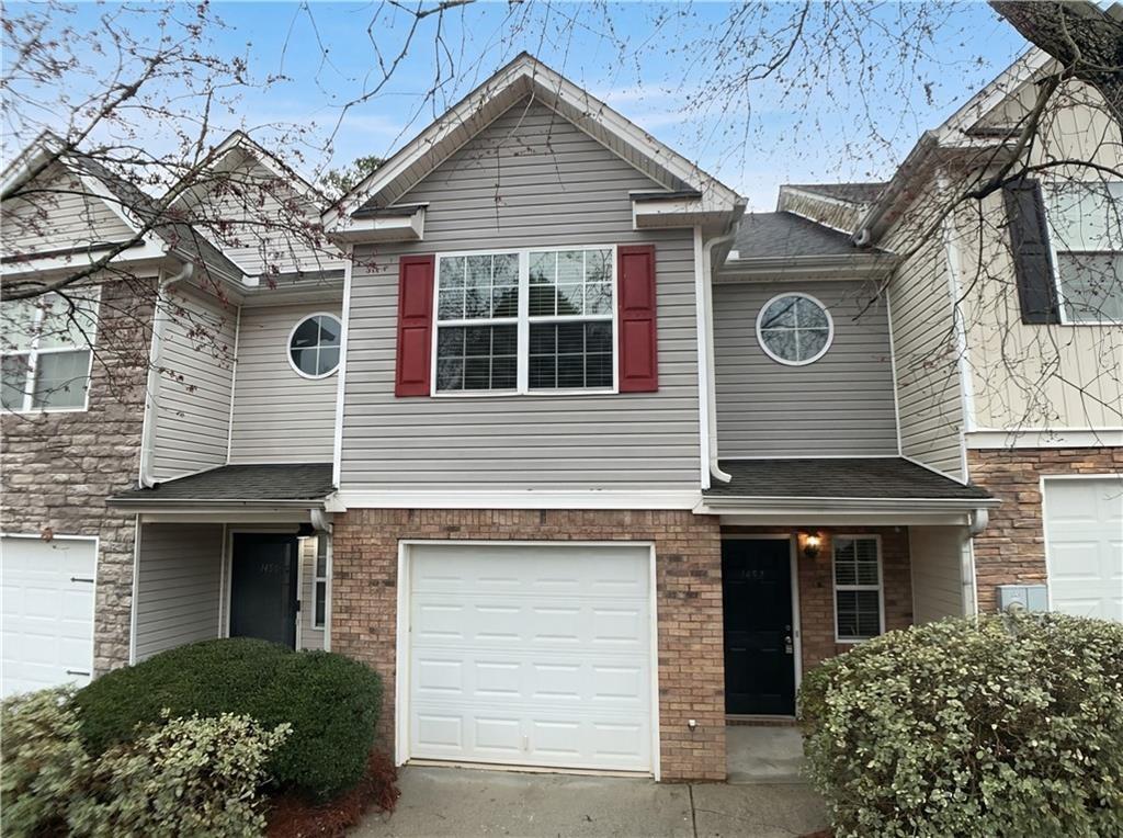 1428 Box Circle Winder, GA 30680 - Photo 2 of 19 a front view of a house with a garden