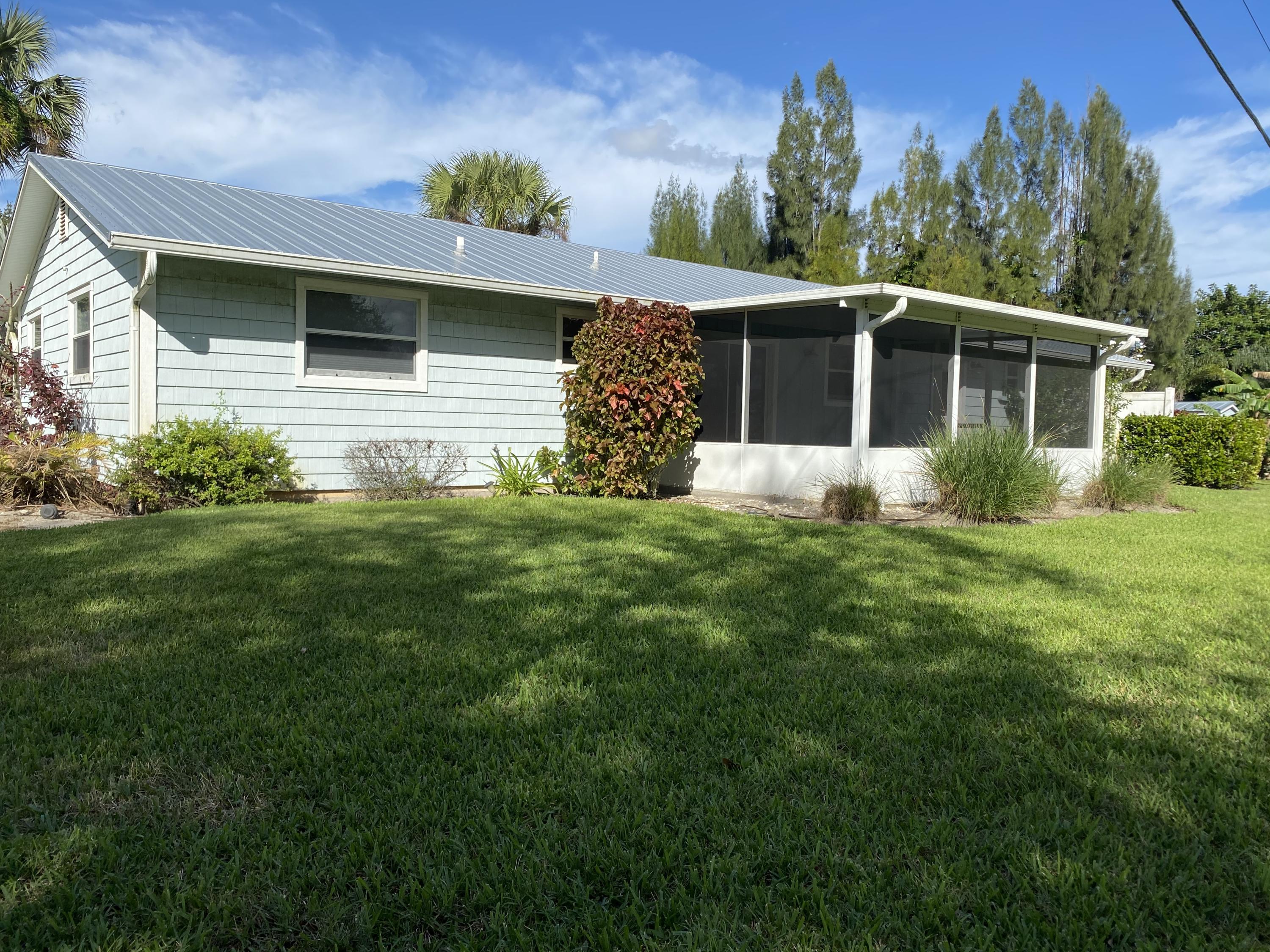 402 Southwest Timber Trail Stuart, FL 34997 - Photo 5 of 6 Rear scr Patio