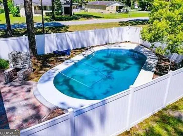 a view of a backyard with a small yard