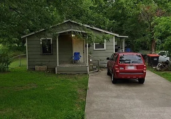 a car parked in front of a house