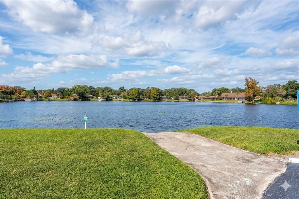 912 Lake Destiny Road, Unit F Altamonte Springs, FL 32714 - Photo 12 of 12 a view of a lake with houses in the back