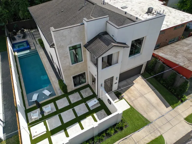 a aerial view of a house with a yard