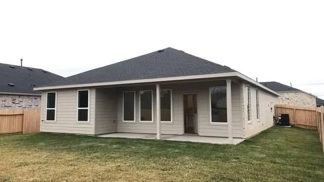 a house that has a big yard in front of it