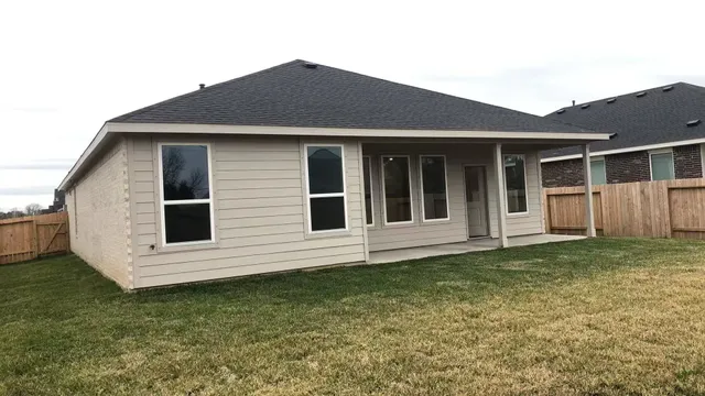 a house that has a big yard in front of it