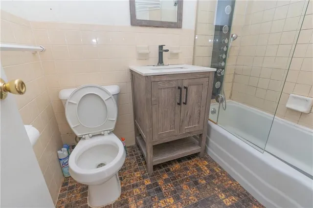 a bathroom with a toilet a sink and bathtub