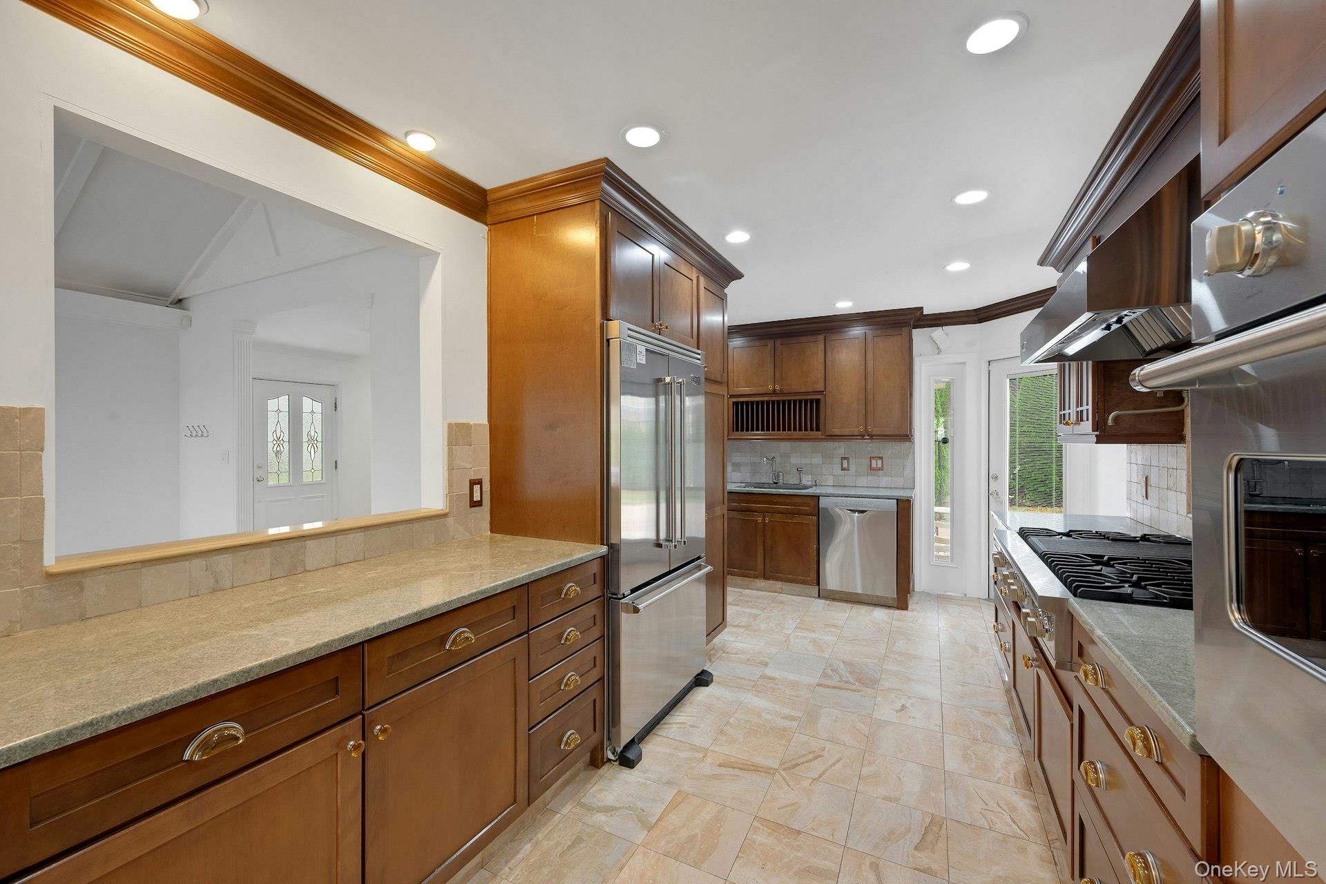 1 Echo Bay Place New Rochelle, NY 10805 - Photo 14 of 47 a kitchen with stainless steel appliances a stove sink and cabinets