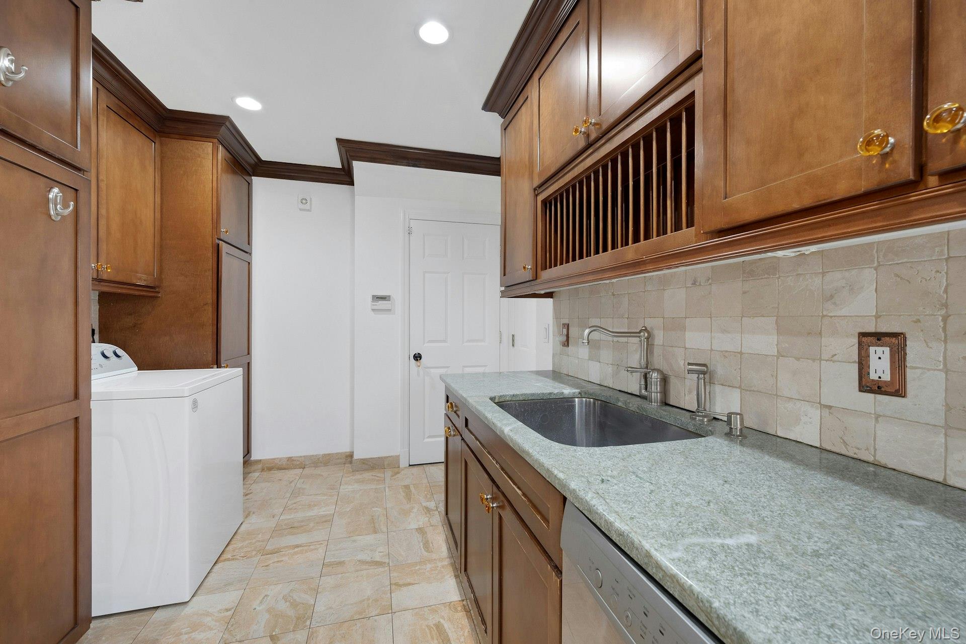1 Echo Bay Place New Rochelle, NY 10805 - Photo 15 of 47 a kitchen with granite countertop a sink and a refrigerator