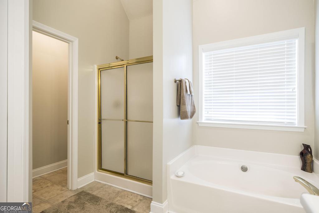 1066 Alma Drive Macon, GA 31216 - Photo 15 of 18 a bathroom with a bathtub and a shower