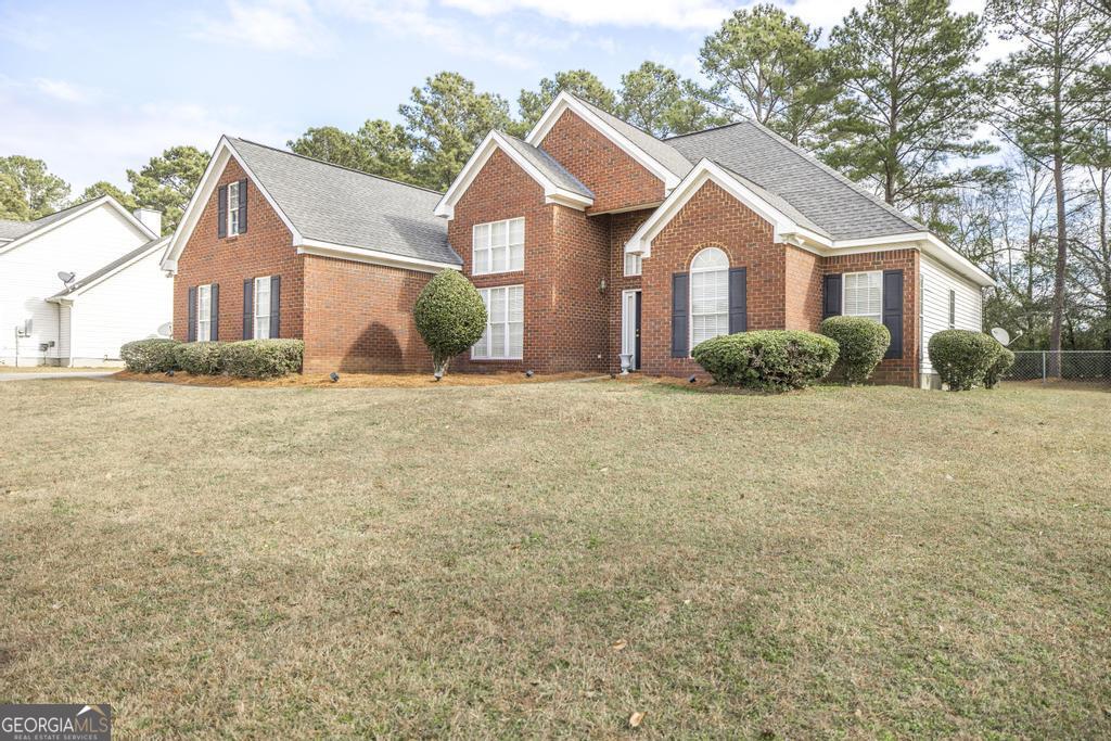 1066 Alma Drive Macon, GA 31216 - Photo 4 of 18 a view of a yard in front of a house