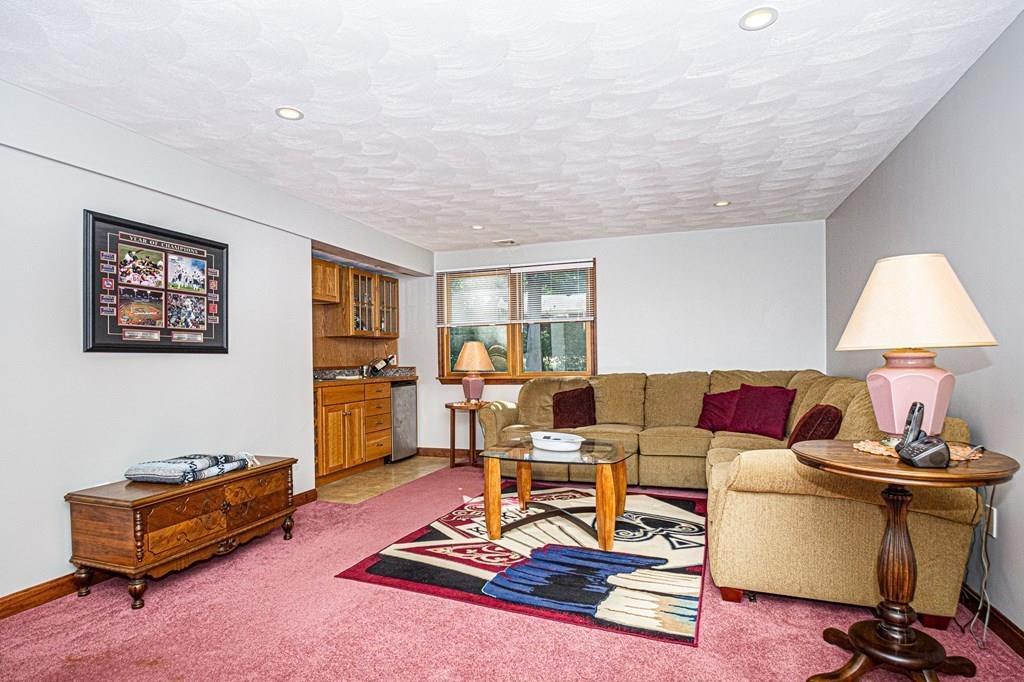 31 Woodland Road Billerica, MA 01821 - Photo 14 of 39 a living room with furniture a rug and a table