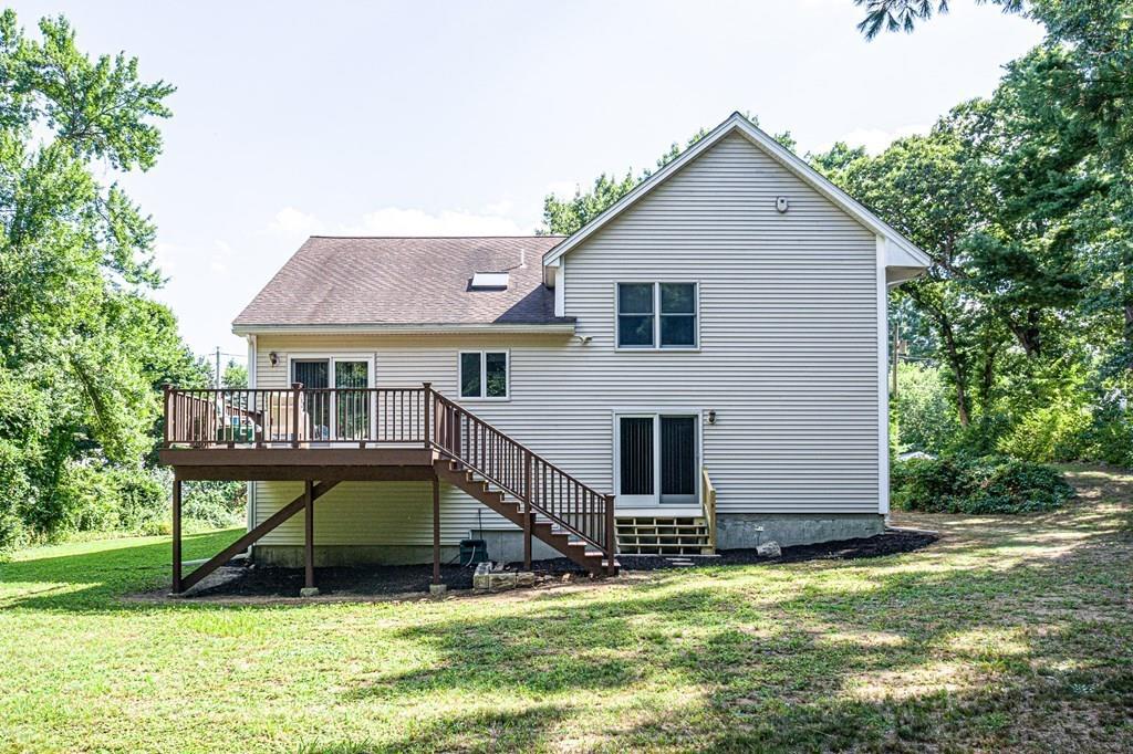 31 Woodland Road Billerica, MA 01821 - Photo 2 of 39 a view of a house with a yard and sitting area