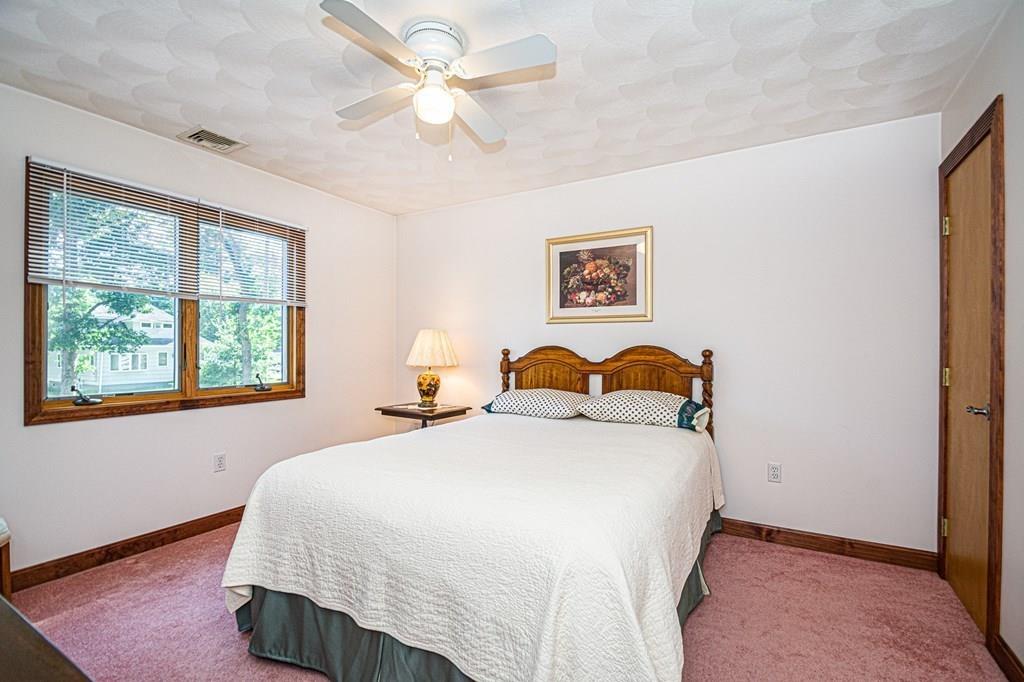 31 Woodland Road Billerica, MA 01821 - Photo 22 of 39 a bedroom with a bed and window