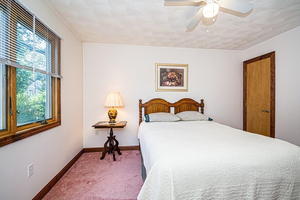 31 Woodland Road Billerica, MA 01821 - Photo 23 of 39 a bedroom with a bed and a window