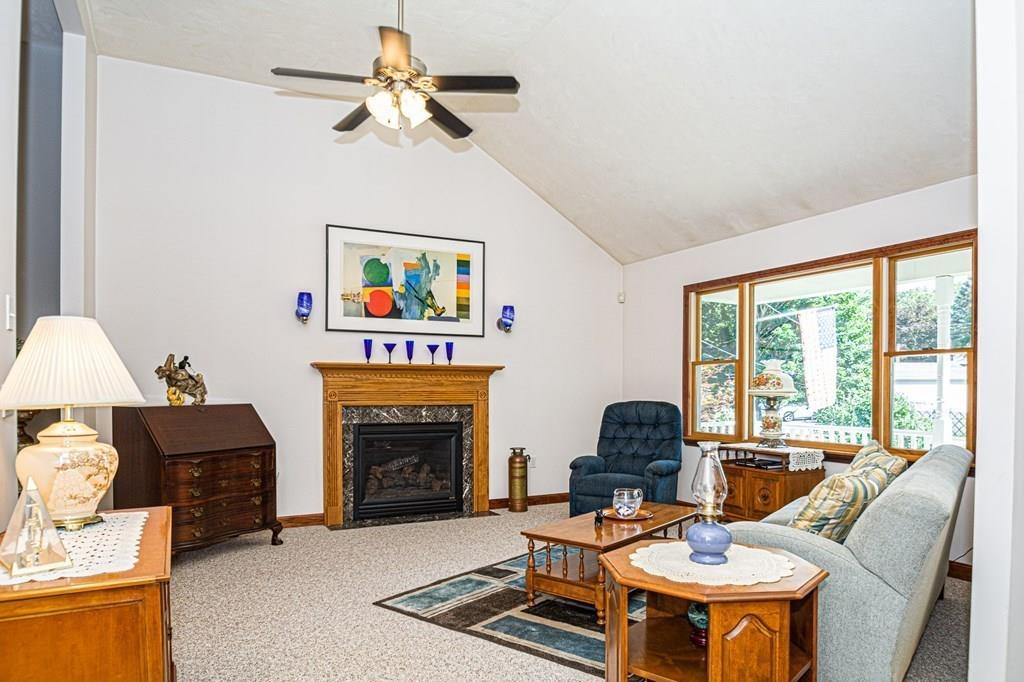 31 Woodland Road Billerica, MA 01821 - Photo 4 of 39 a living room with furniture and a fireplace